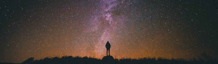 Person watching the stars at night