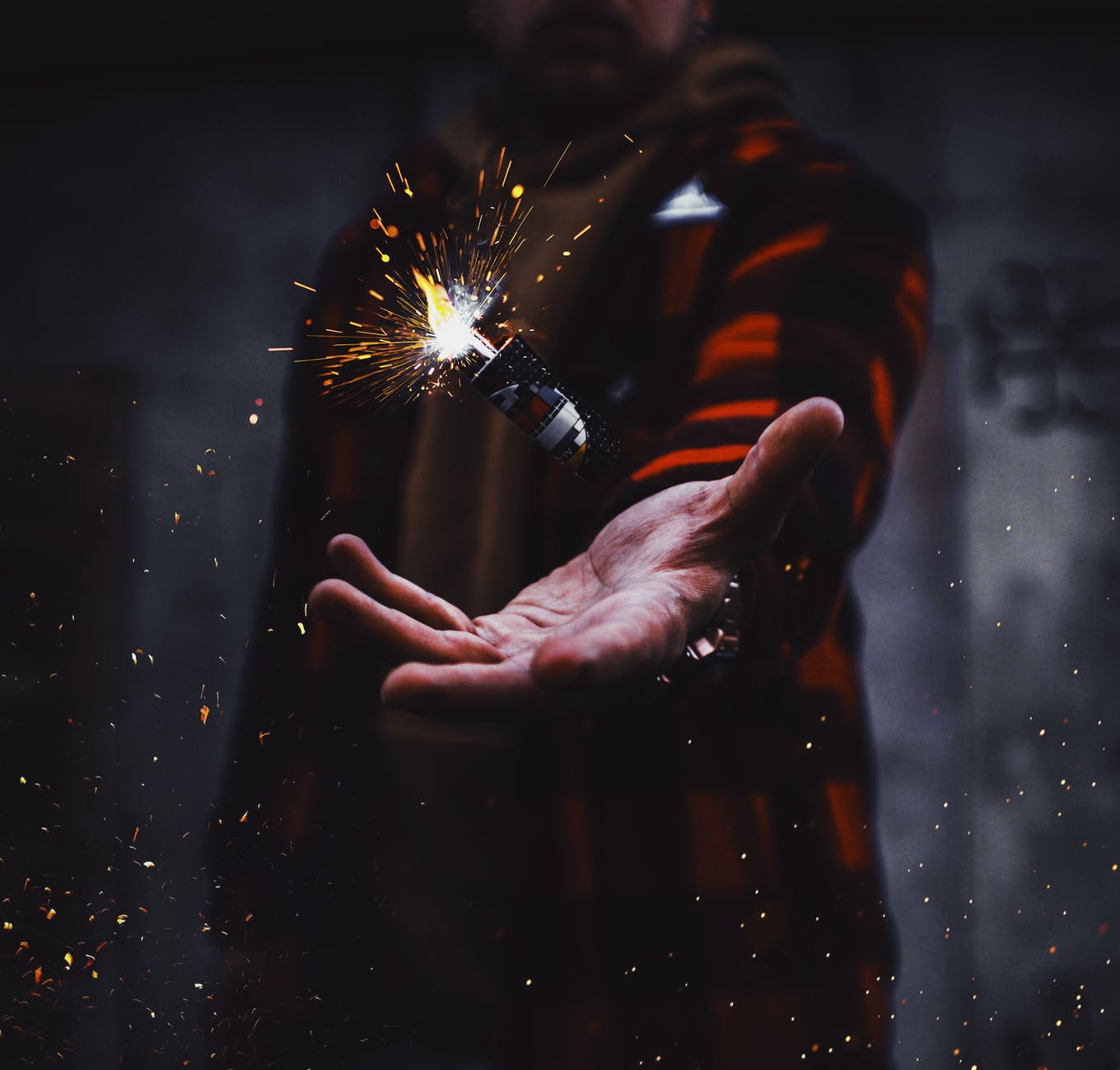 person tossing firecracker